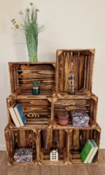Burnt wooden crates used as decorative shelf